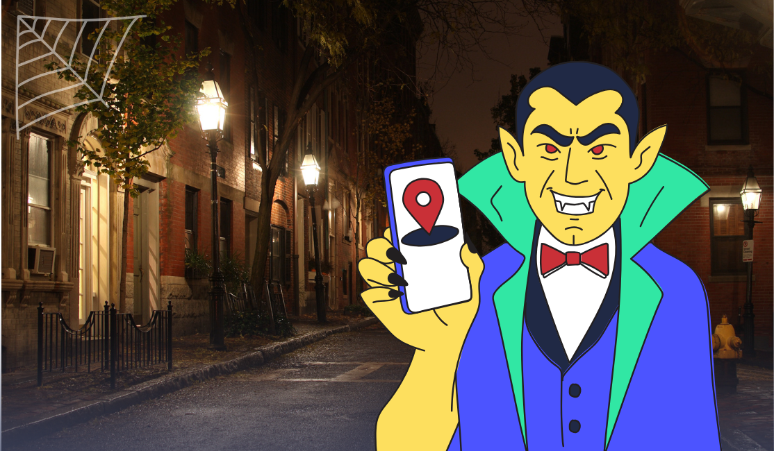 A cartoon vampire stalks a city street at night with a phone GPS in his hand