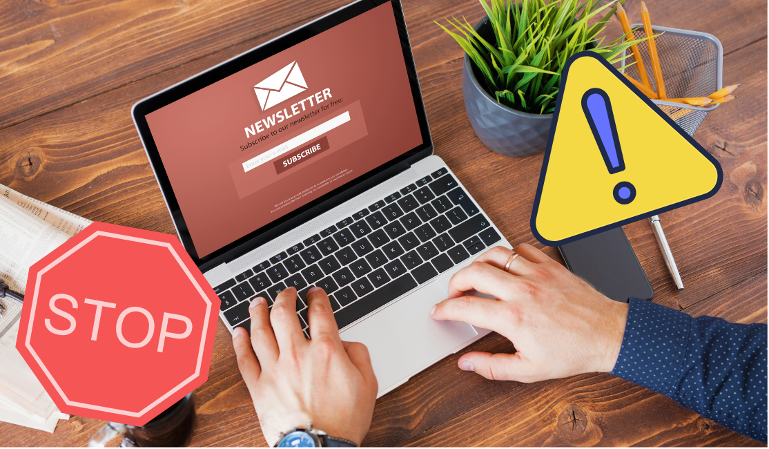 A person is about to enter their email into an newsletter subscription field while two signs warn to stop and take caution