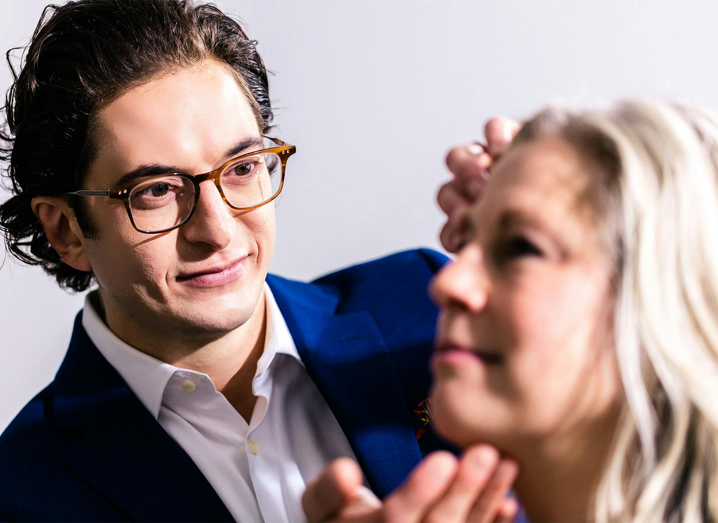 Cleveland Facial Plastic Surgeon, Dr. Frankel evaluating a female patient's facial features