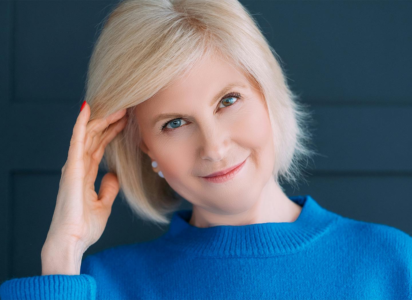 Middle-aged woman with short blonde hair