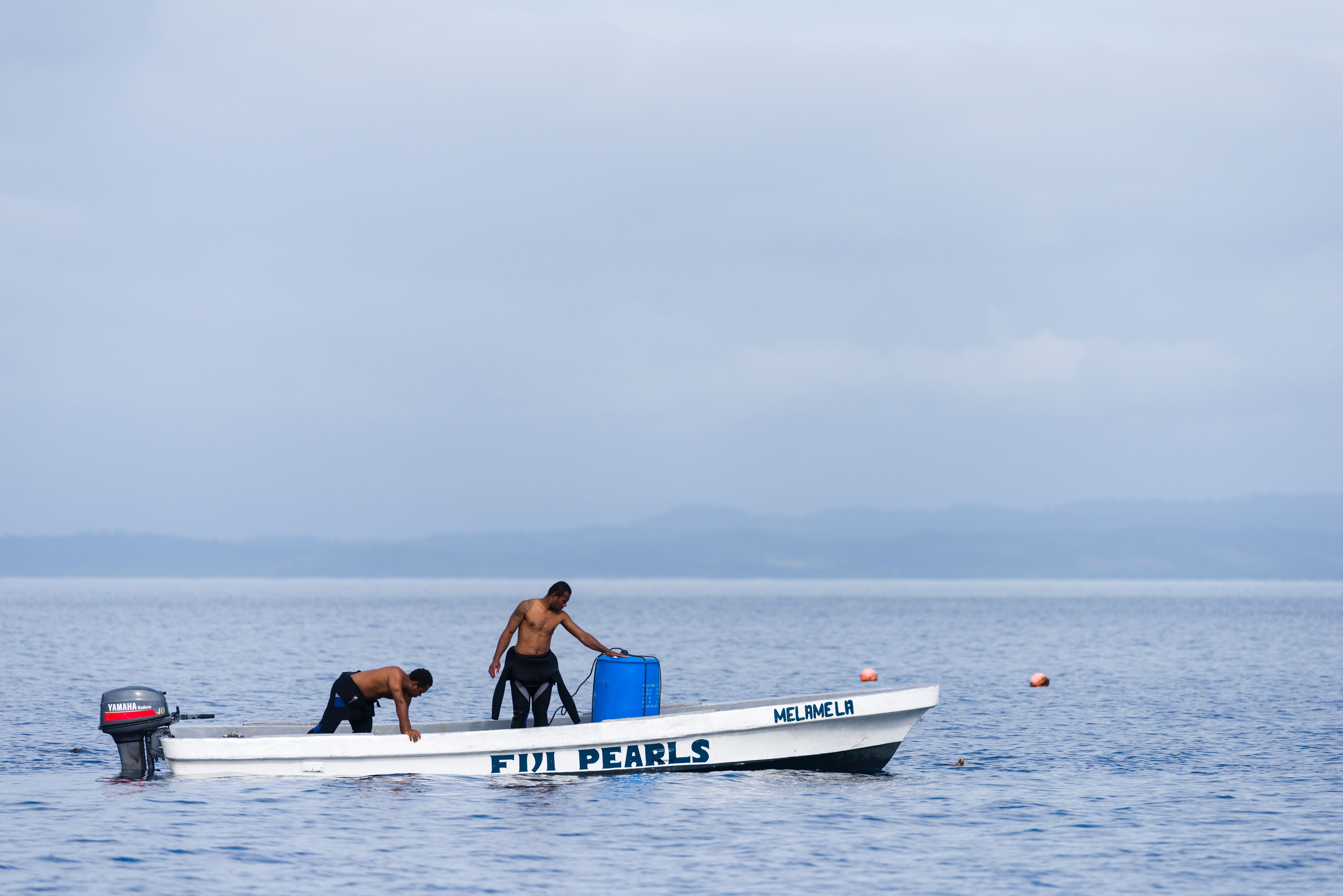 Taucher auf einem Boot