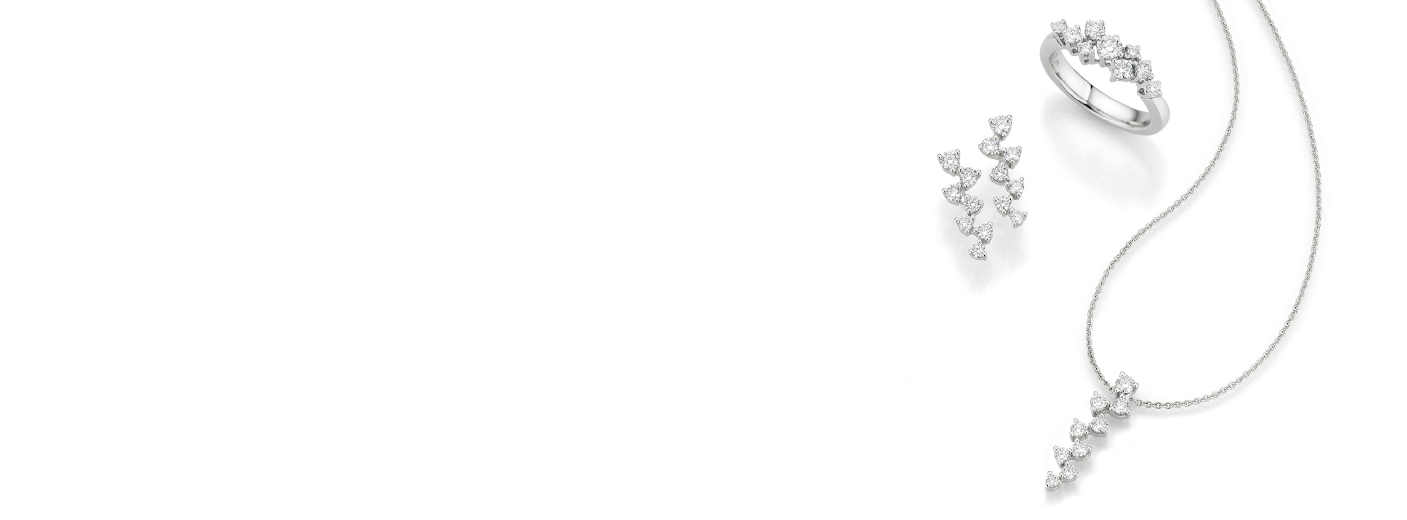 N1 Diamonds Markenheader - drei Schmuckstücke vor einem weißen Hintergrund