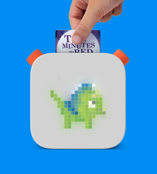Hand inserting card onto Yoto Player