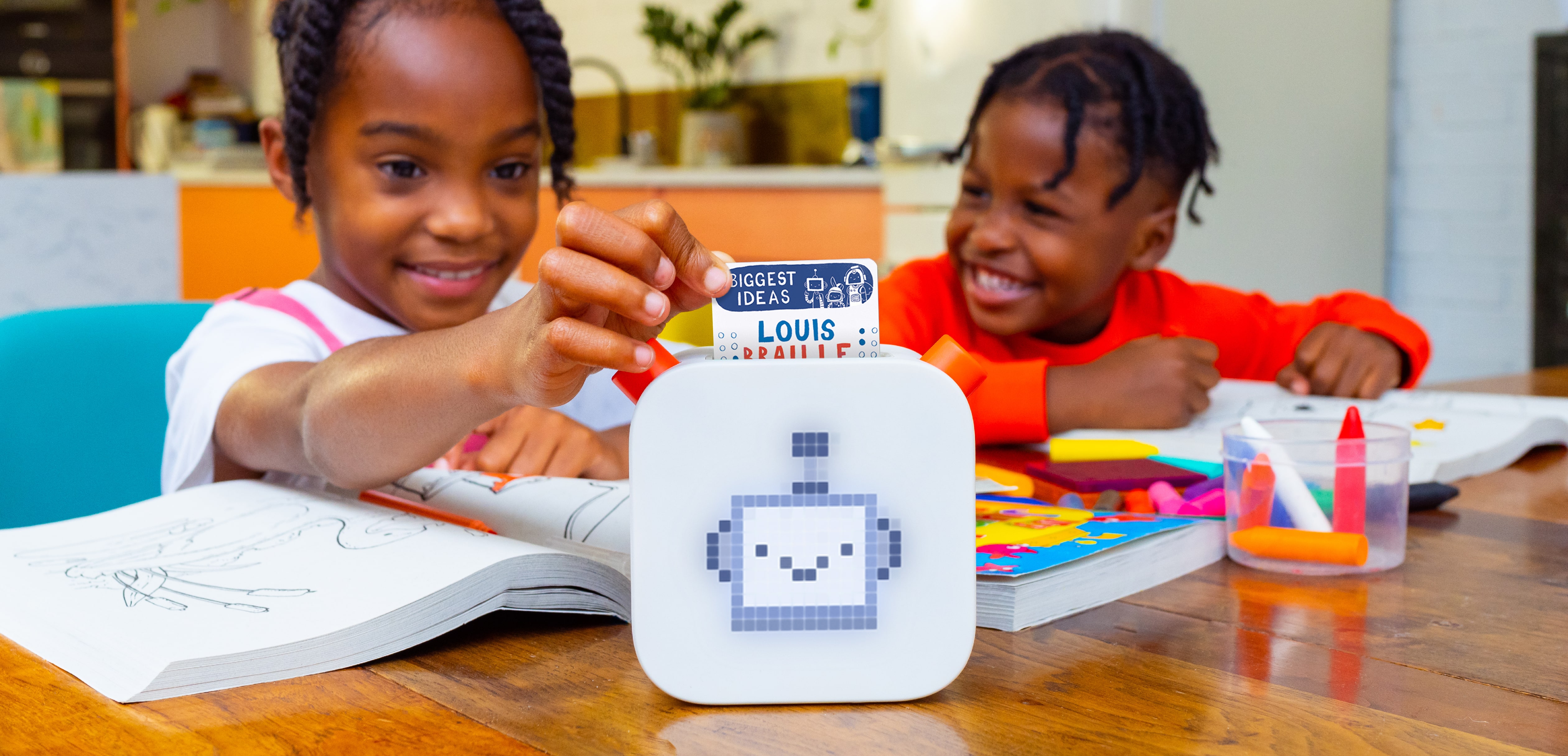 Child putting a Yoto Card into Yoto Player