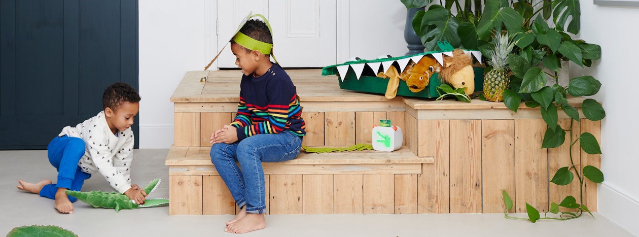 Two kids playing on some steps