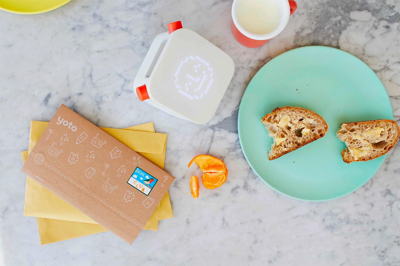 Image of yoto player, envelope and toast on a plate