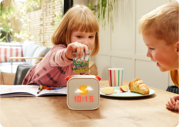 Child putting card into Yoto Player