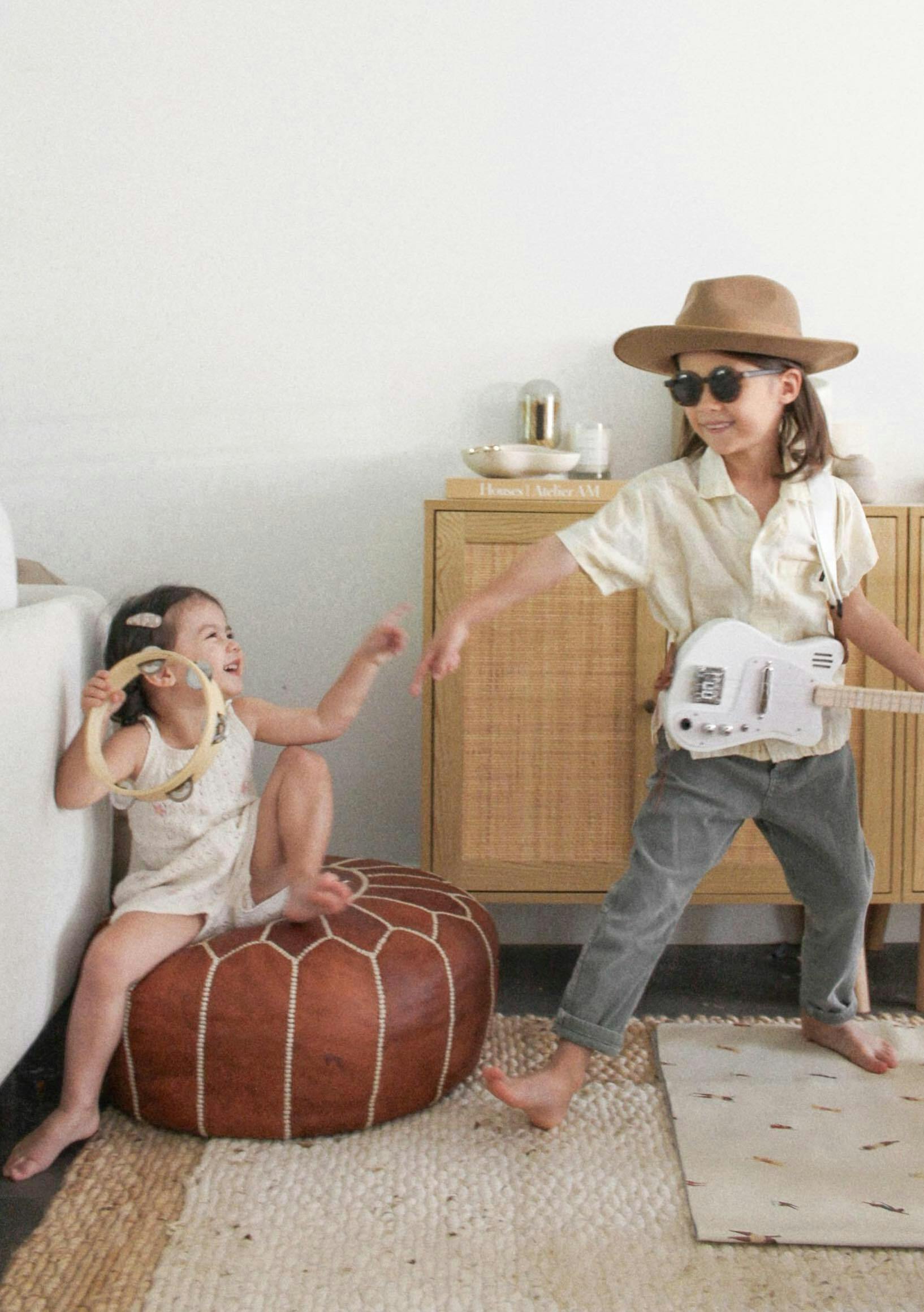 Two children playing with instruments