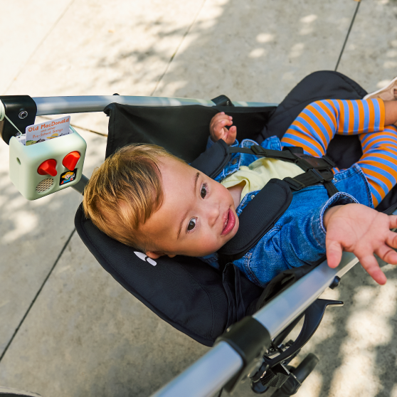 Child with Yoto Mini in stroller