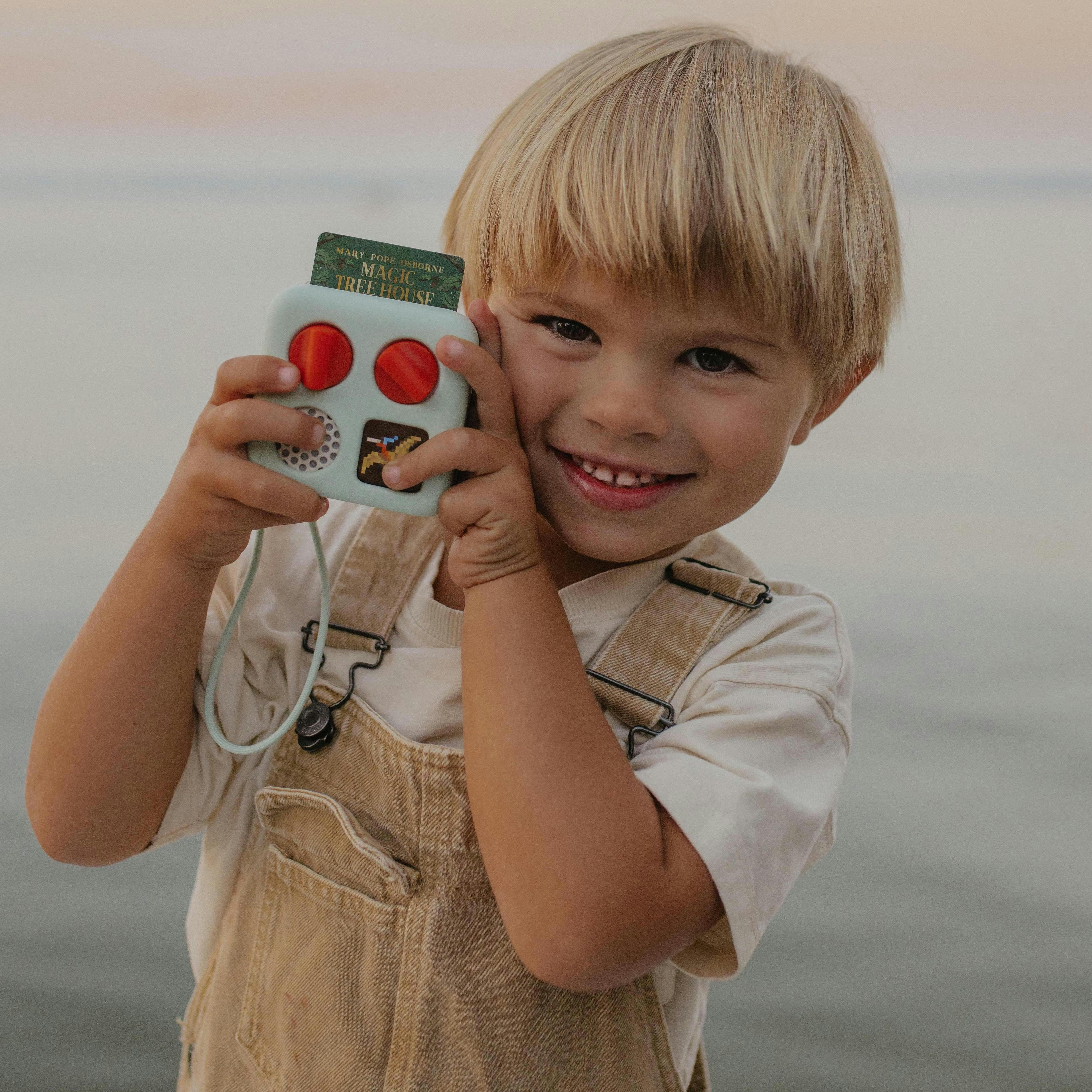 Child holding Yoto Mini