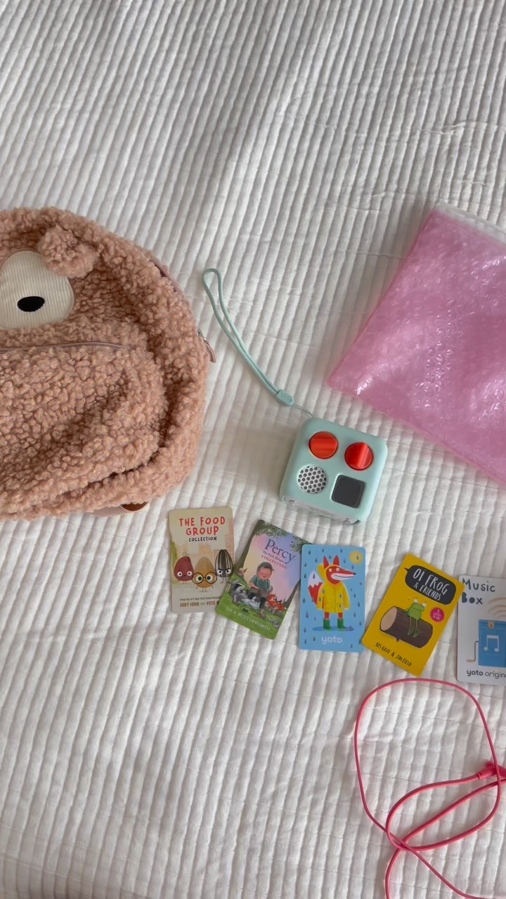 Yoto Mini and Cards on bed