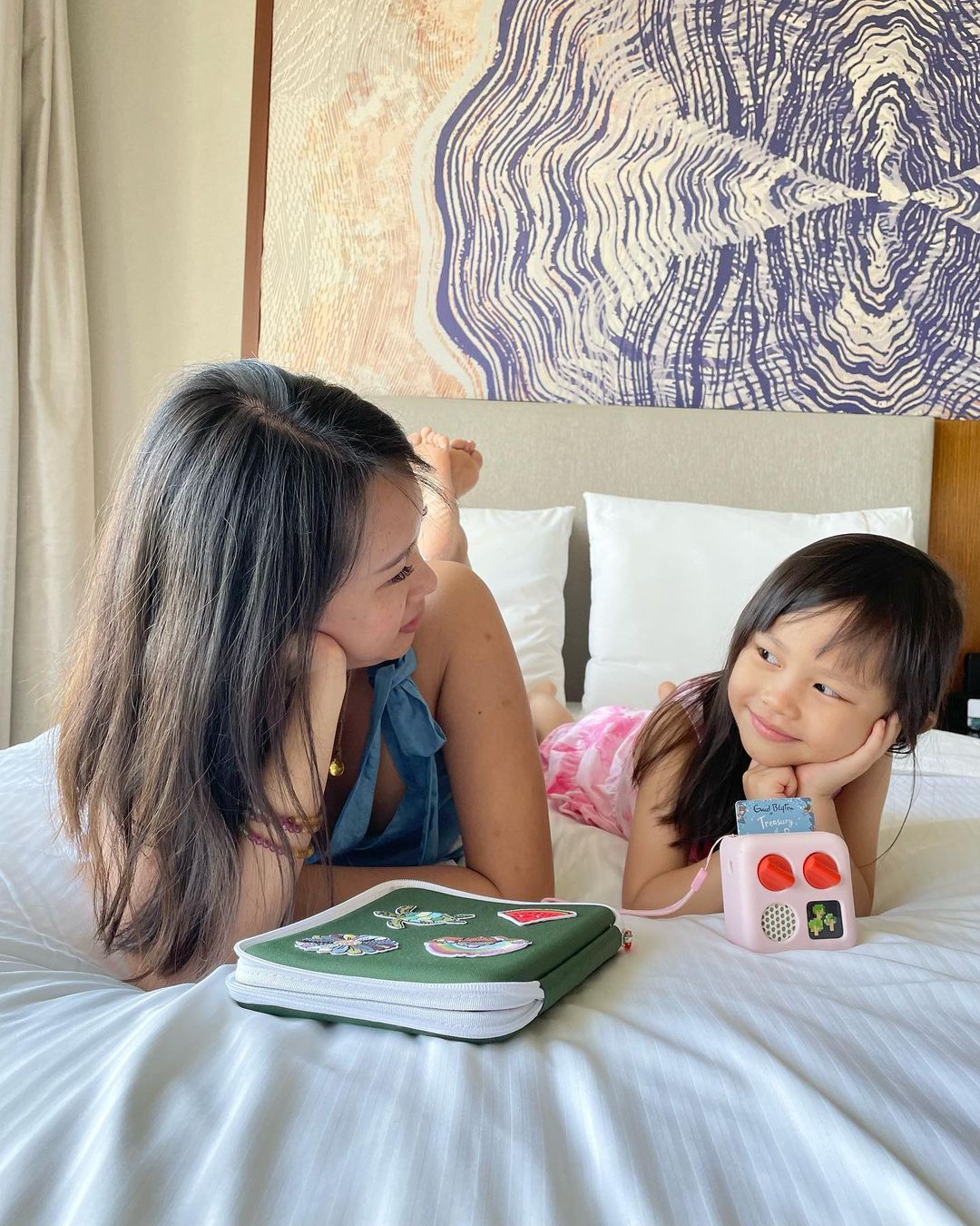Mother and daughter listening to a Yoto Mini