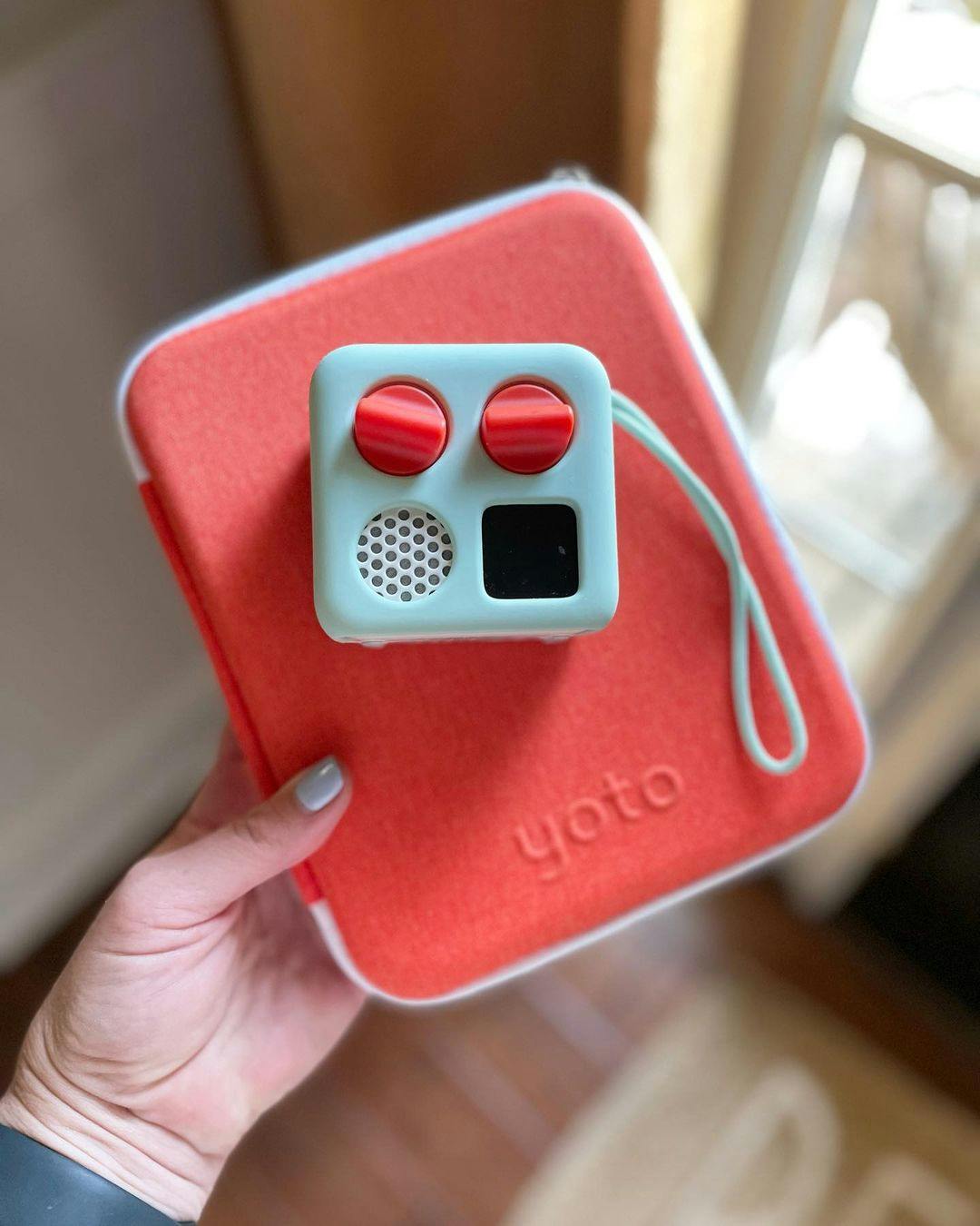 A Yoto Mini on a Card Case
