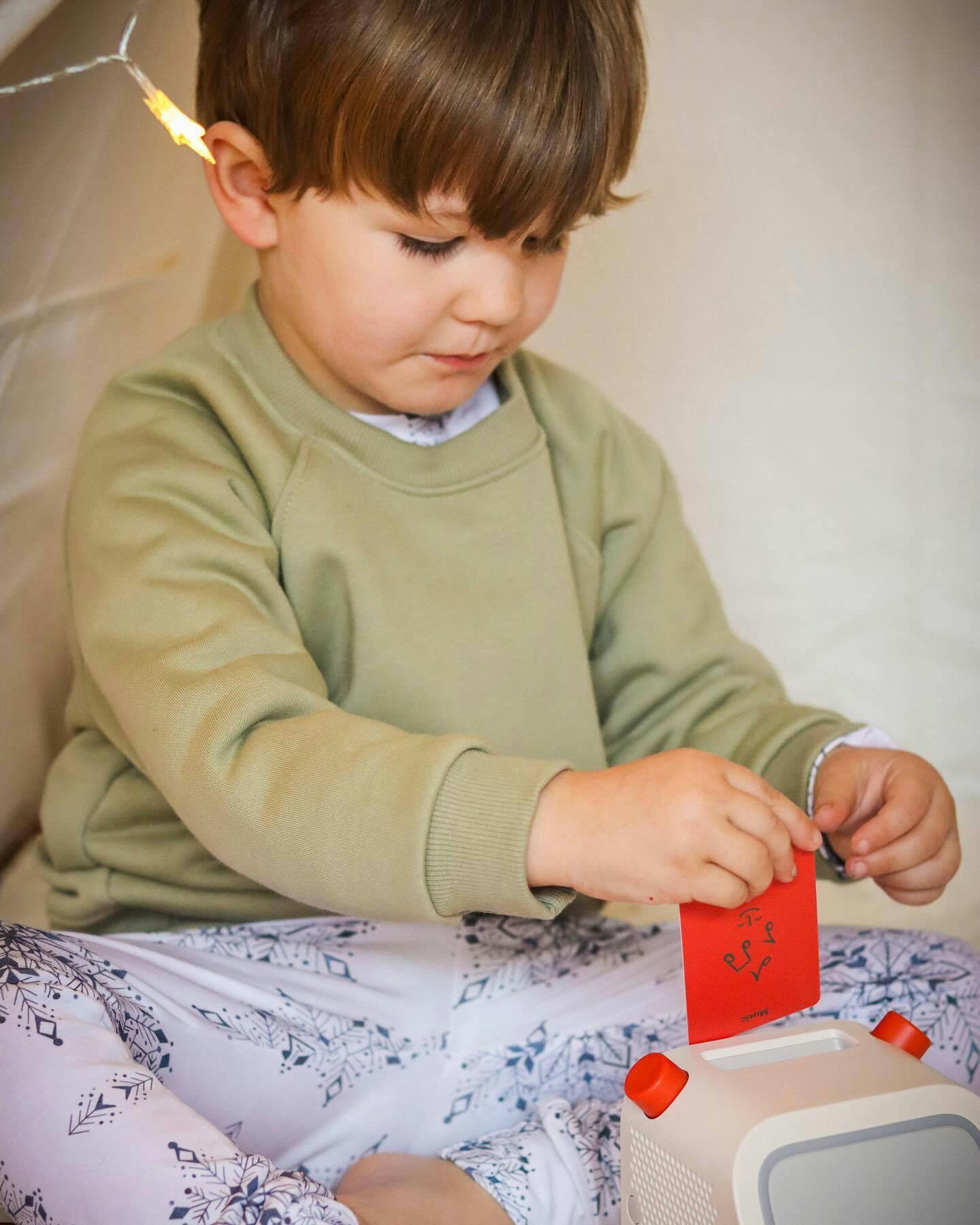 Child playing with Yoto Player