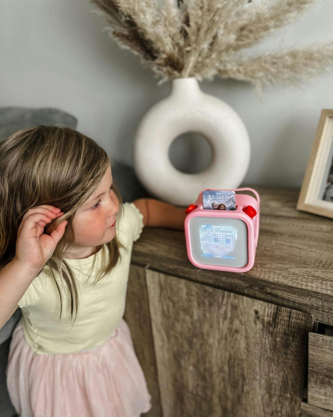 Child listening to Yoto Player