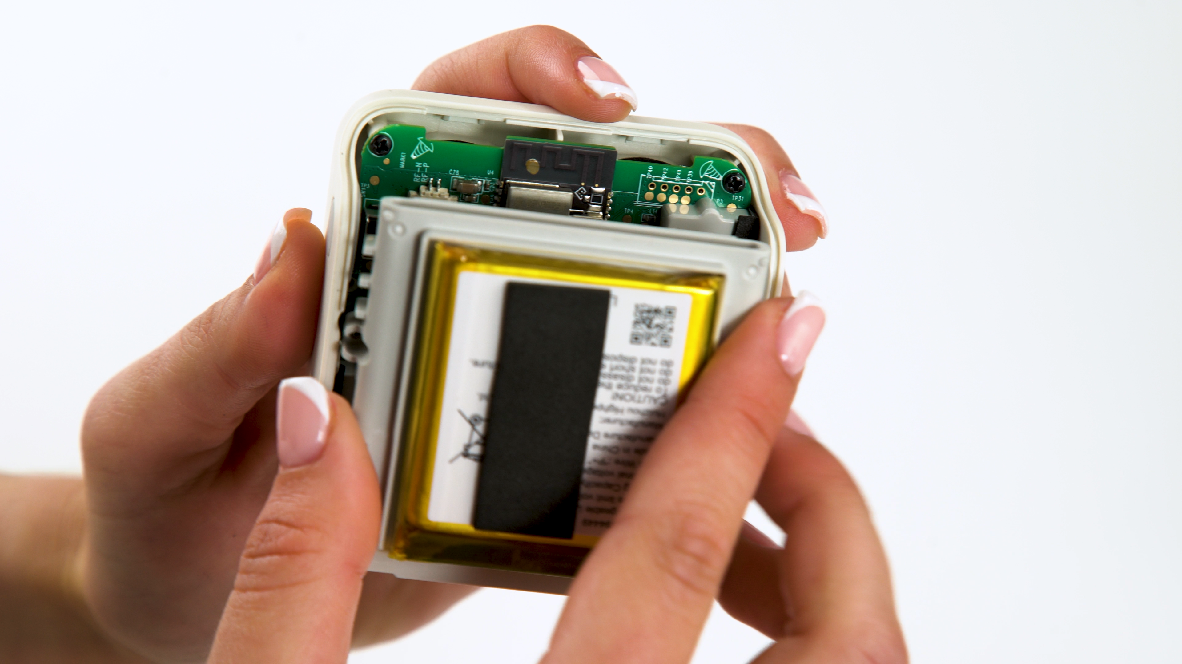 Gently push battery assembly into mini