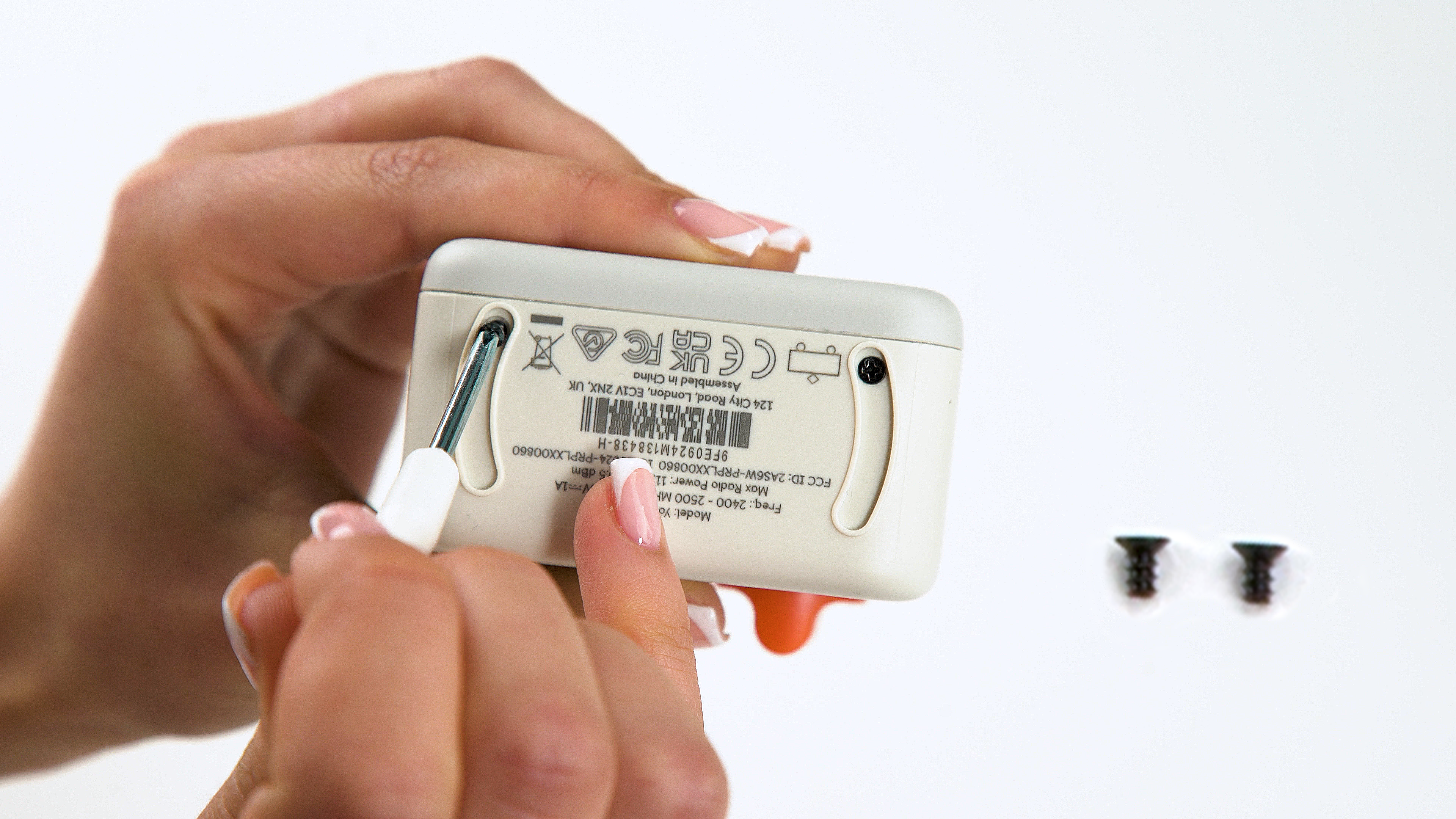 Secure the case with the two shorter philips screws provided