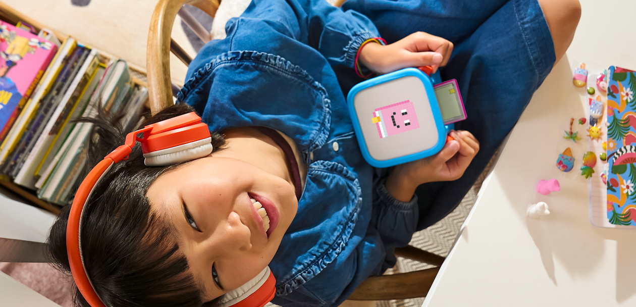 Child using Yoto Headphones with their Player