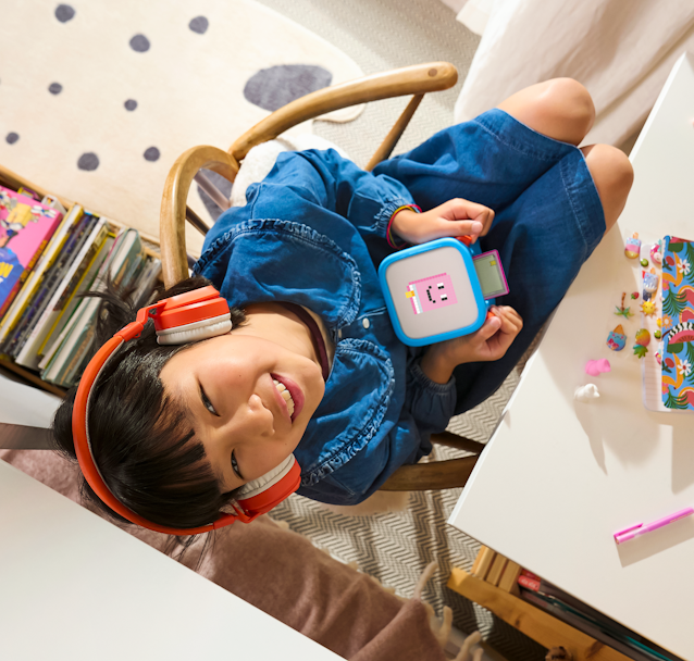 Child using Yoto Headphones with their Player