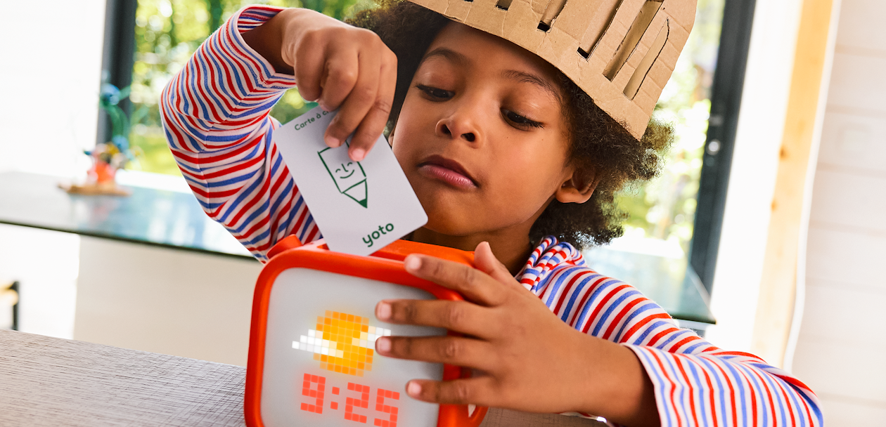 Boy putting card in a Player