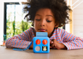 Child listening to Yoto Mini and Peter Rabbit