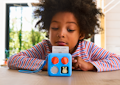 Child listening to Yoto Mini and Peter Rabbit