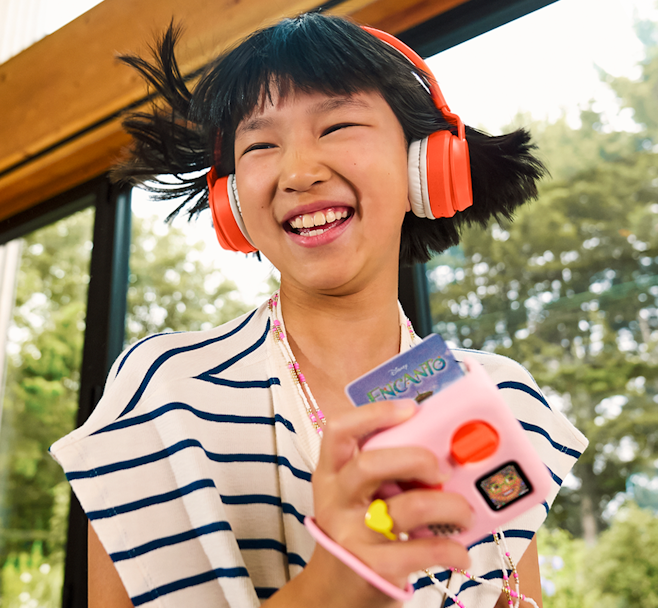 Child Playing with Yoto Mini and Disney Encanto Original Songs