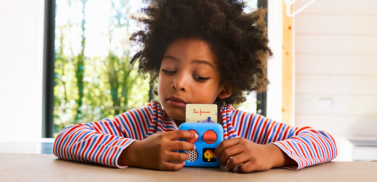 Child listening to Yoto Player