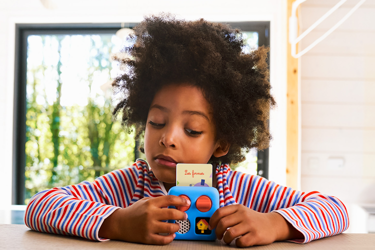 Child listening to Yoto mini
