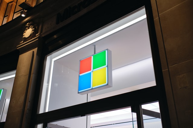 Microsoft’s logo placed above a glass door
