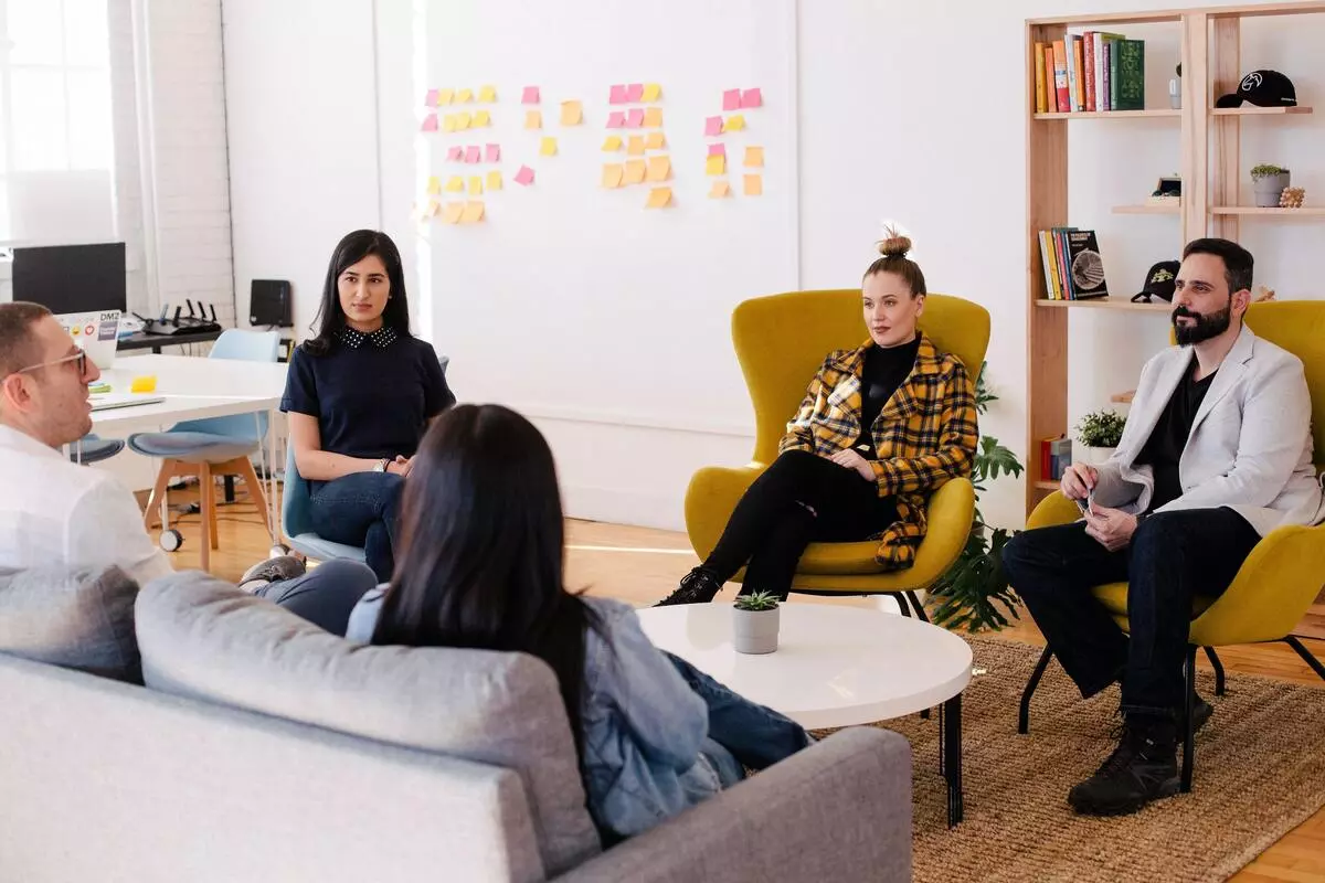 A group of men and women in the middle of a discussion