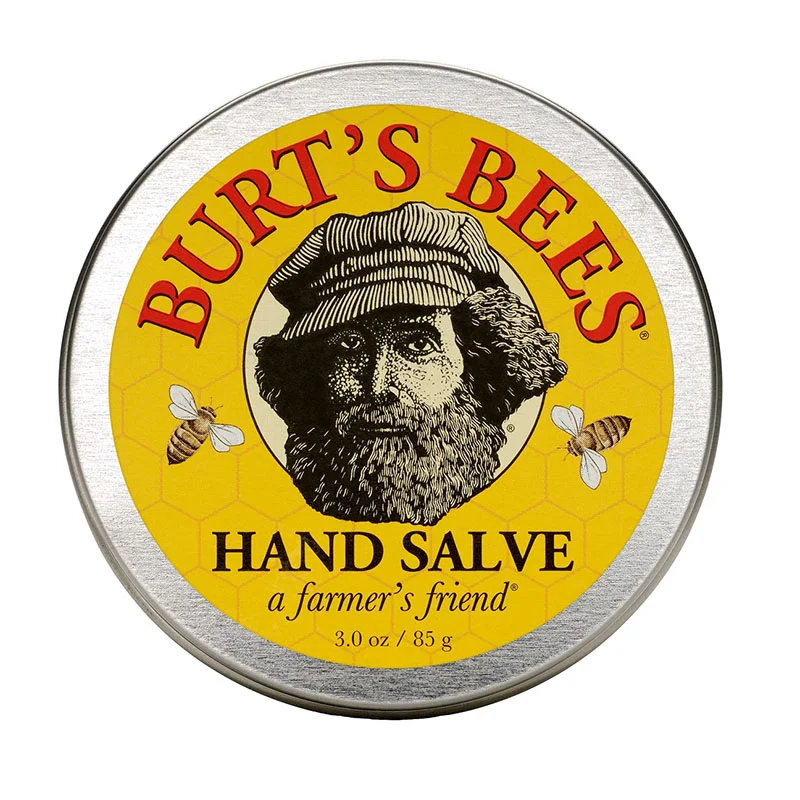A yellow tin of hand salve from Burt’s Bees with an old man’s face as a logo
