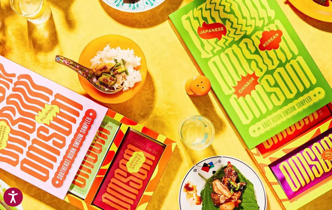 A spread of Asian dishes served in bowls and Omsom sampler sauces.