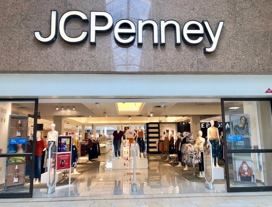 A storefront with a massive logo of JCPenney