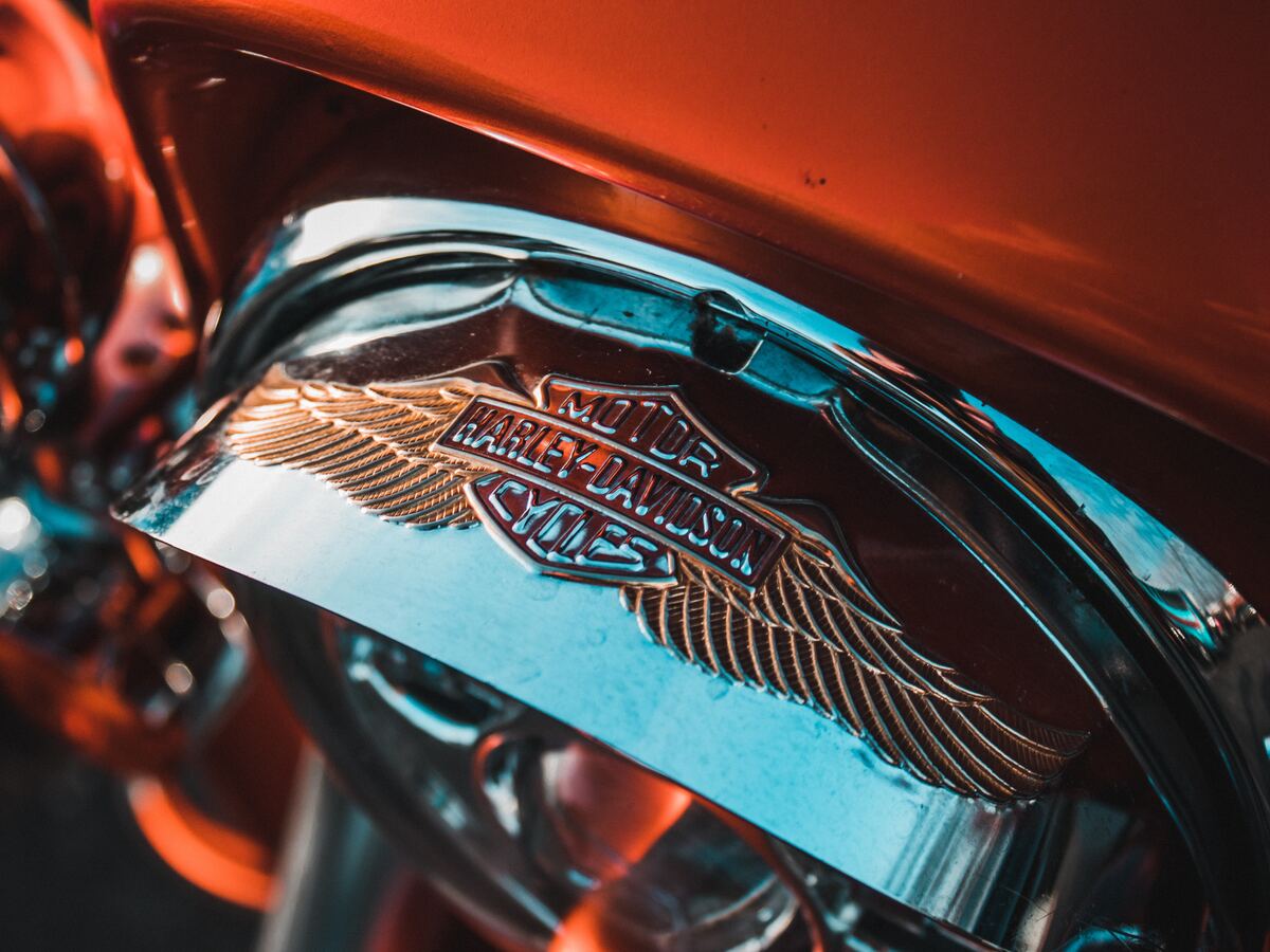 A chrome-plated emblem on a motorcycle