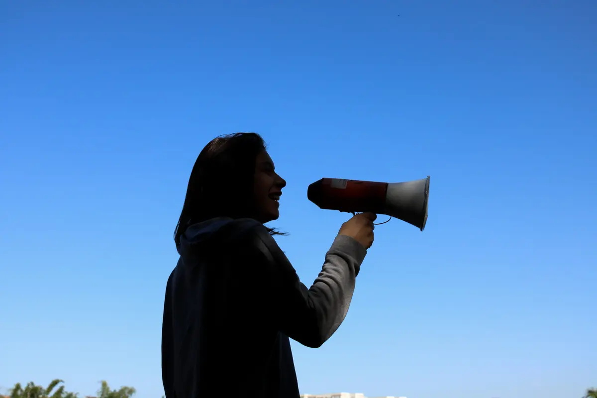 A person speaks through a megaphone
