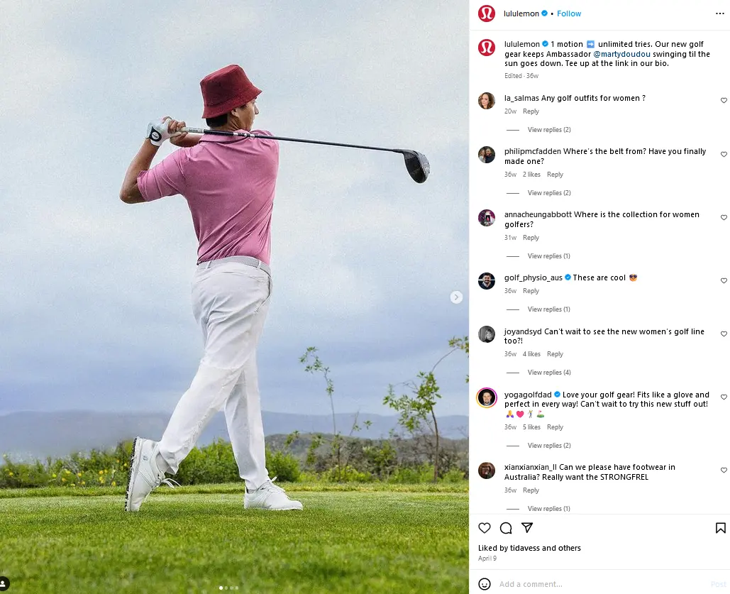 A man in a pink shirt and white pants hits a golf ball