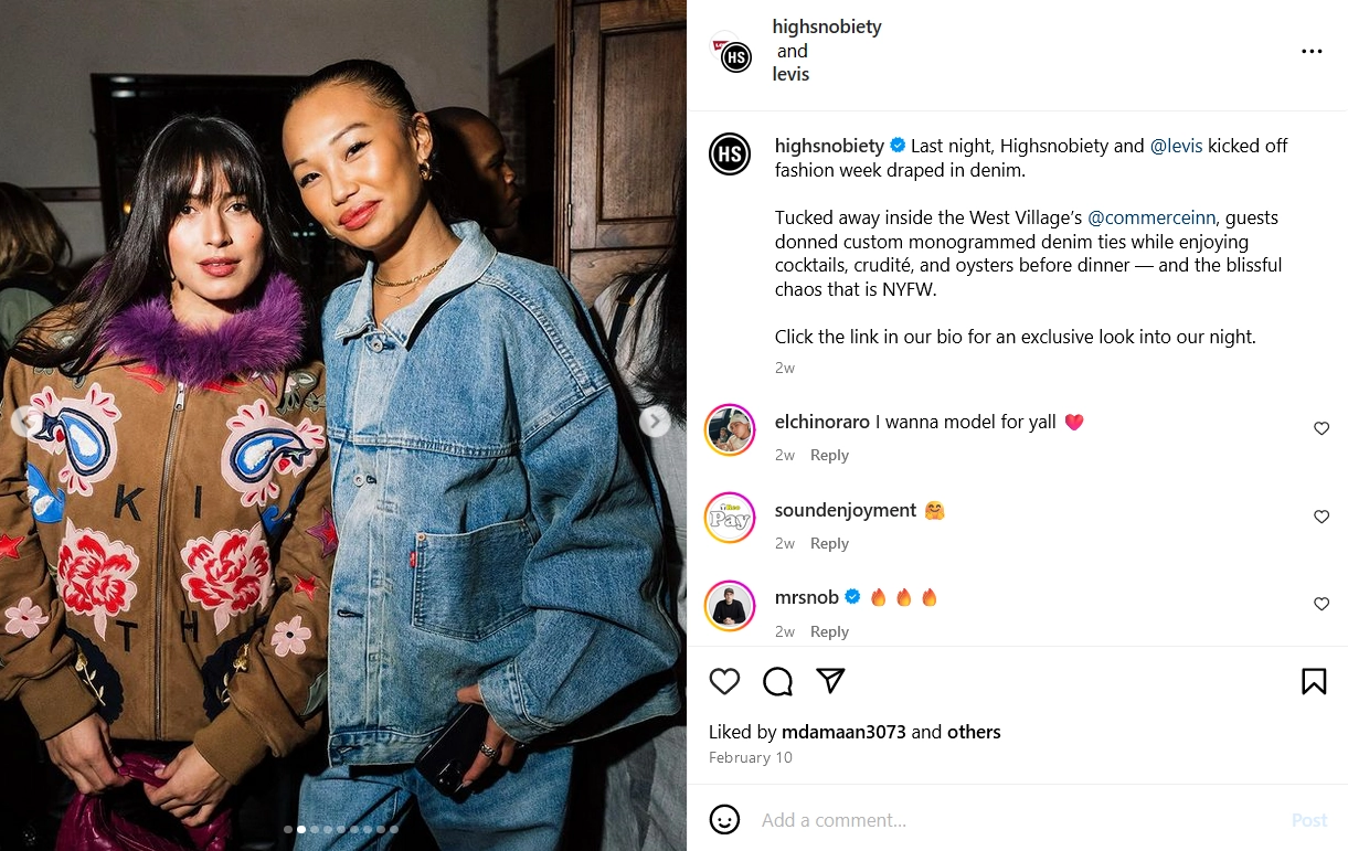 Two women pose side-by-side with a smile