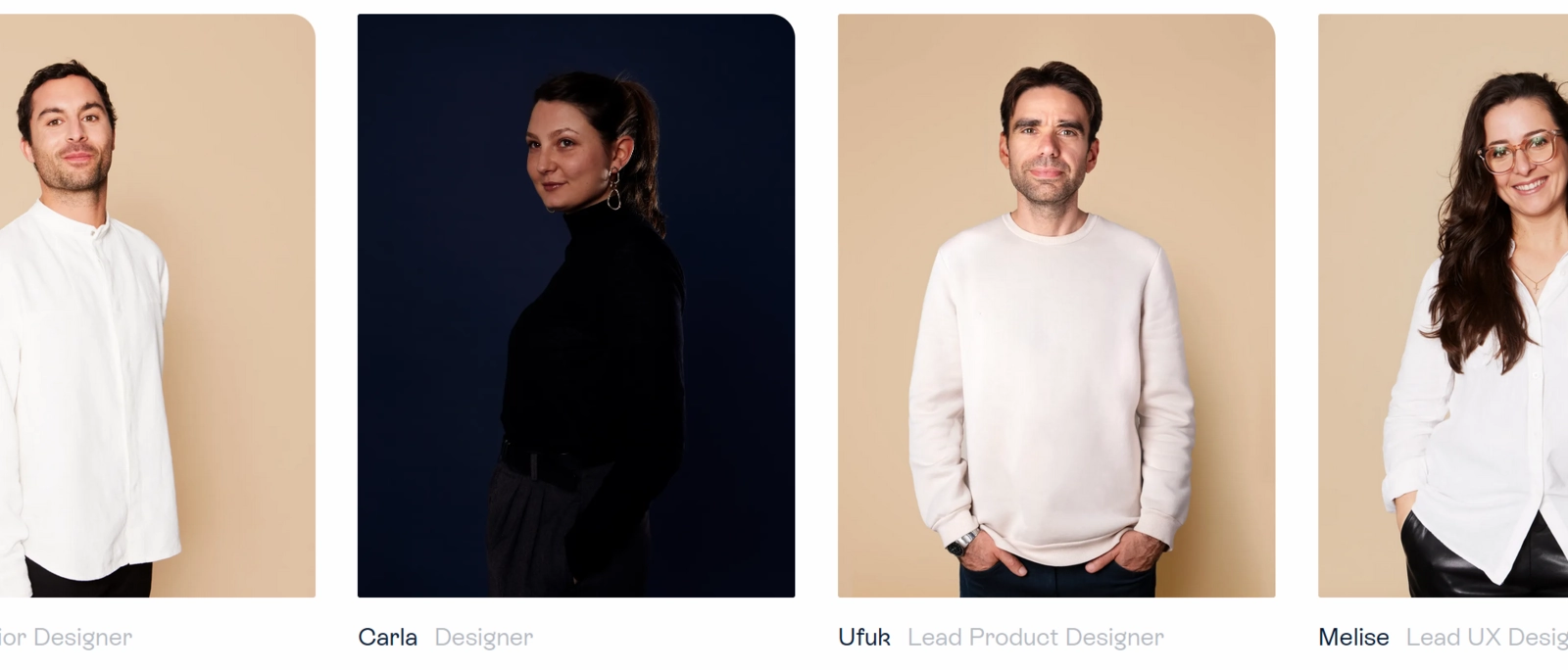 A gallery of two men and two women striking a pose for their company headsho