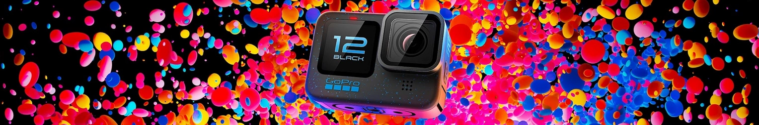 A small black camera with a colorful backdrop of blobs in blue, orange, and red.