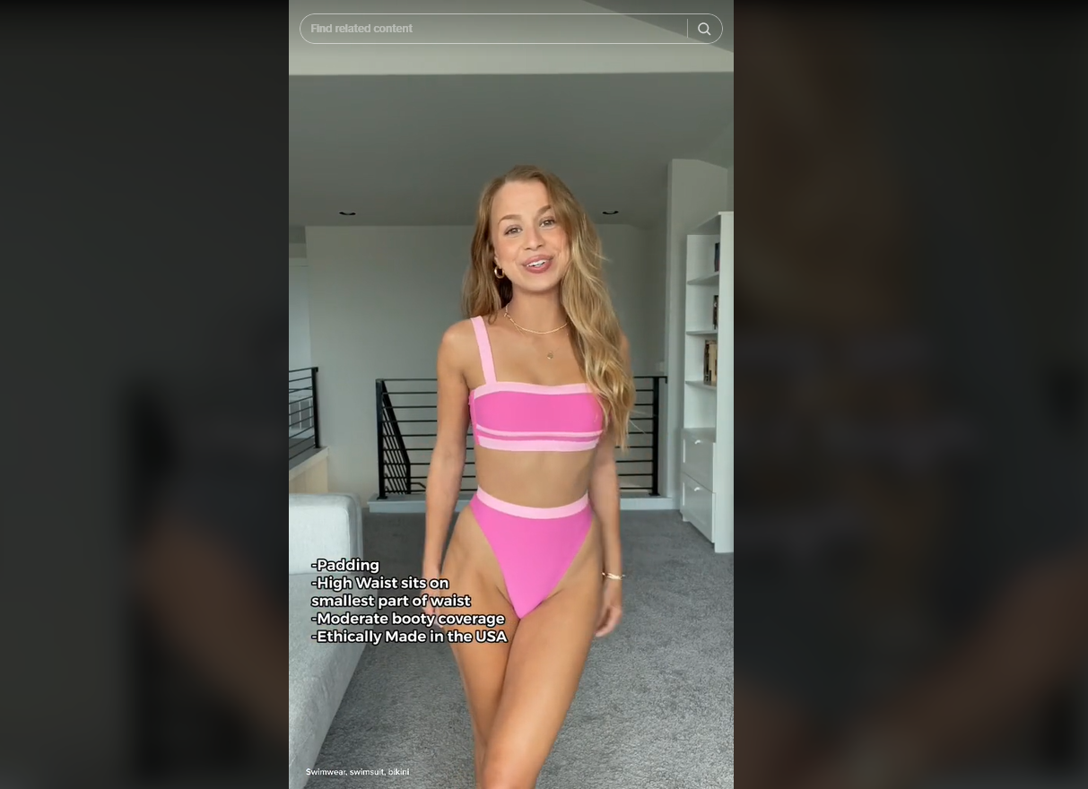 A woman in a pair of pink high-waist bikini