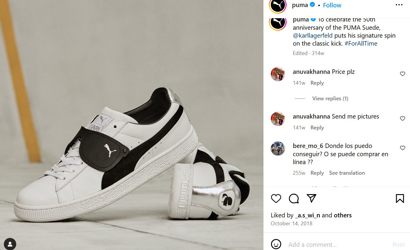 A pair of white sneakers with black details