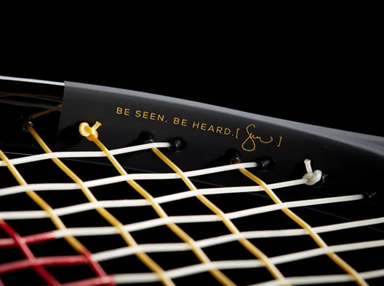 A close-up shot of a tennis racket’s inner rim