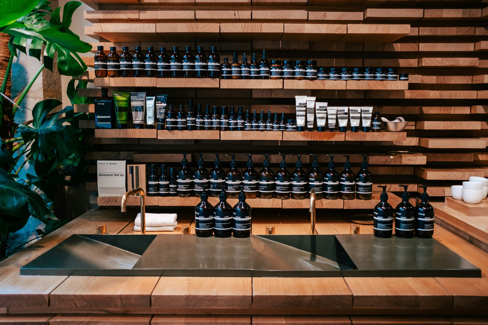 A display of bottles of wine, hand cream, and body wash