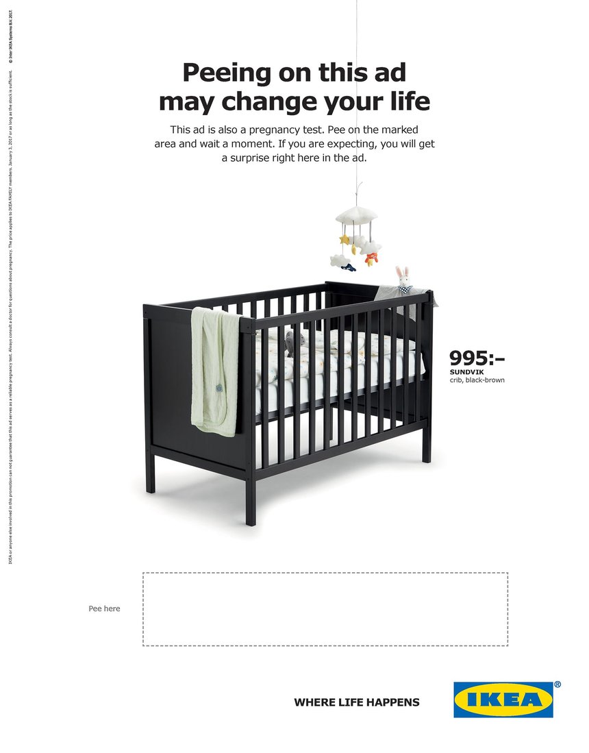 A baby crib with a white blanket over it