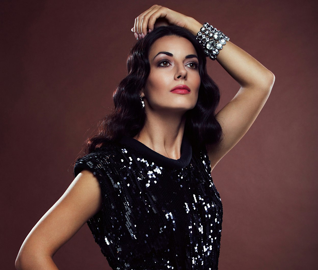 woman in a black dress posing for a picture