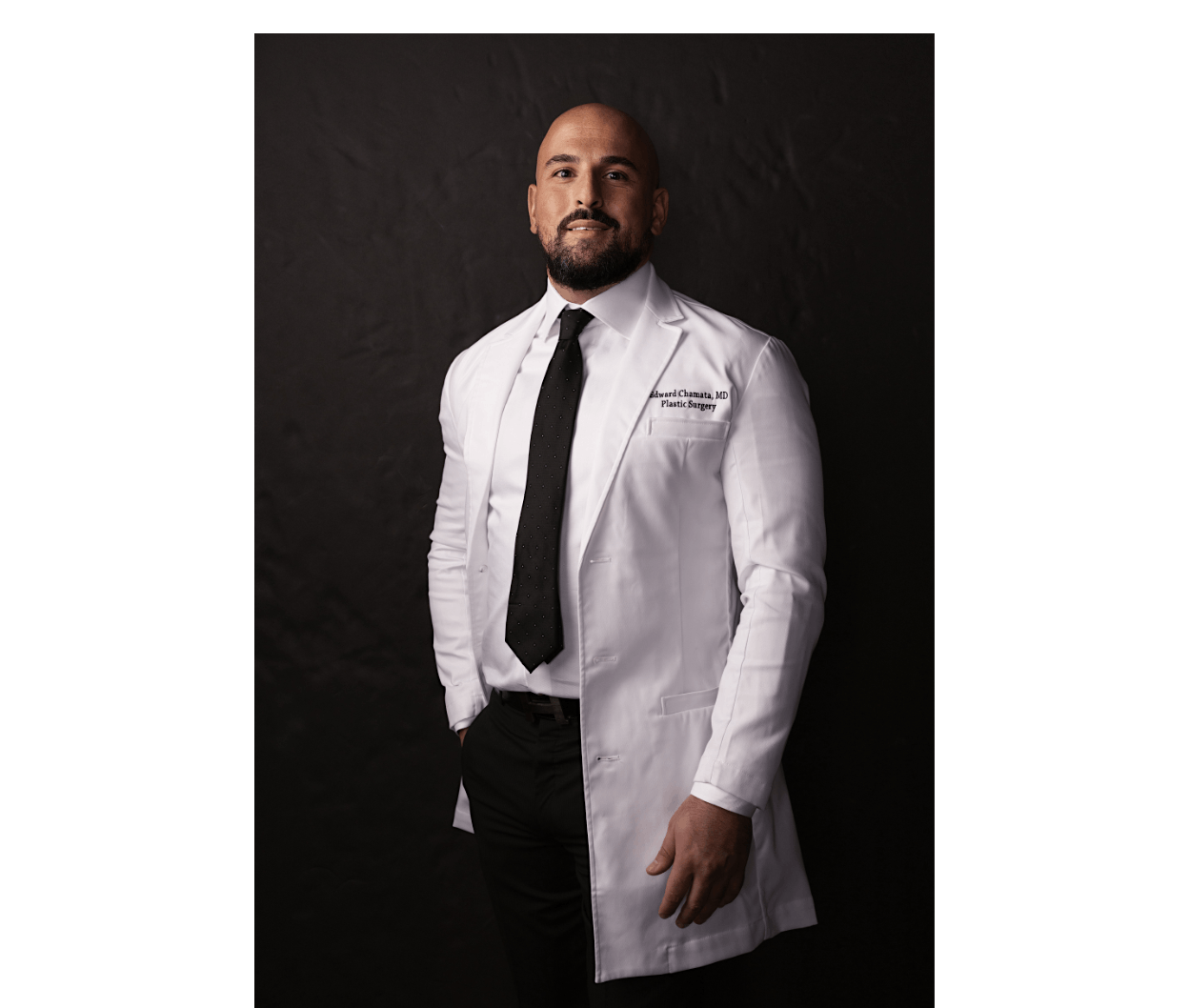 Dr. Chamata in white lab coat