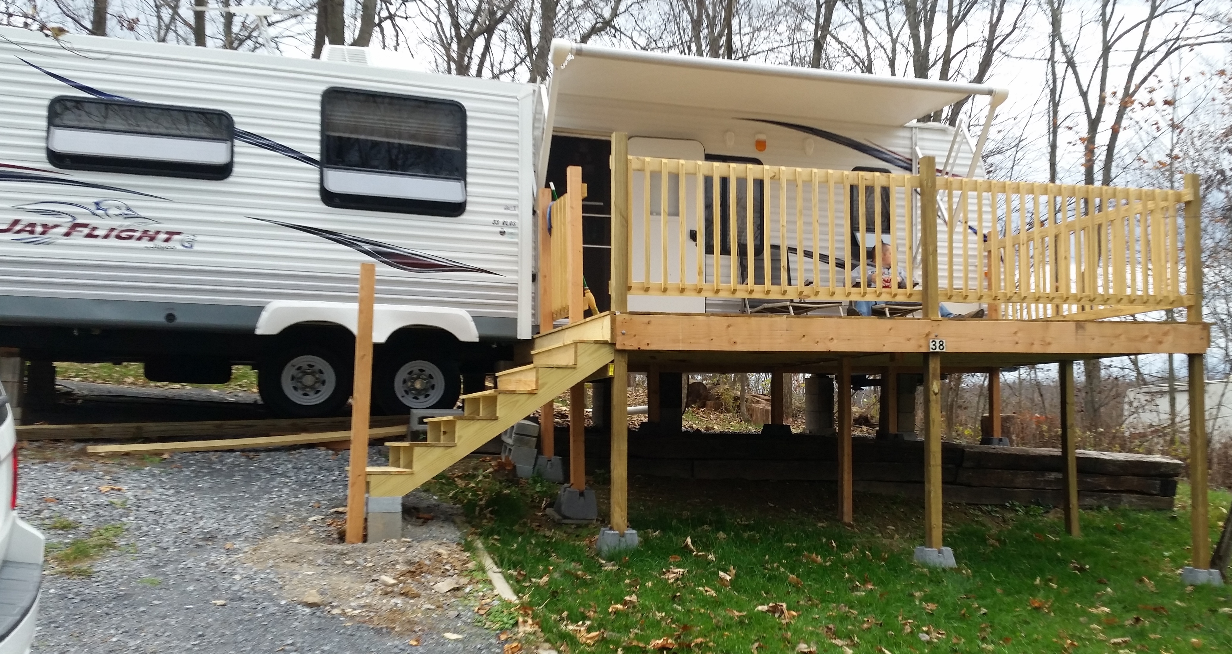 2014 Jayco Jay Flight trailer on permanent lot with deck