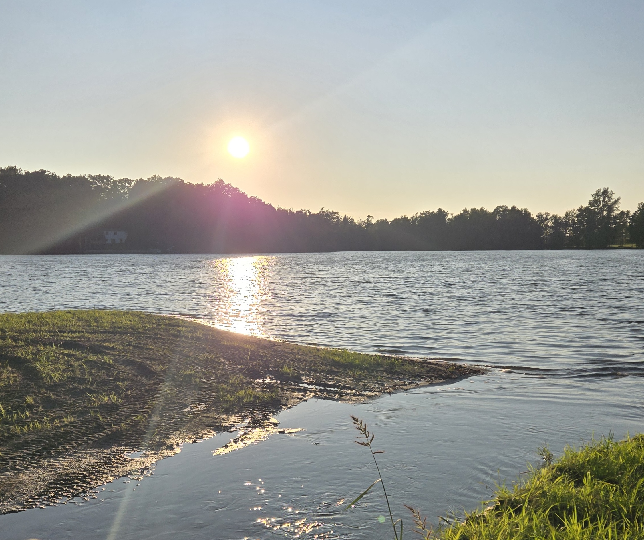 Sun setting over a small lake