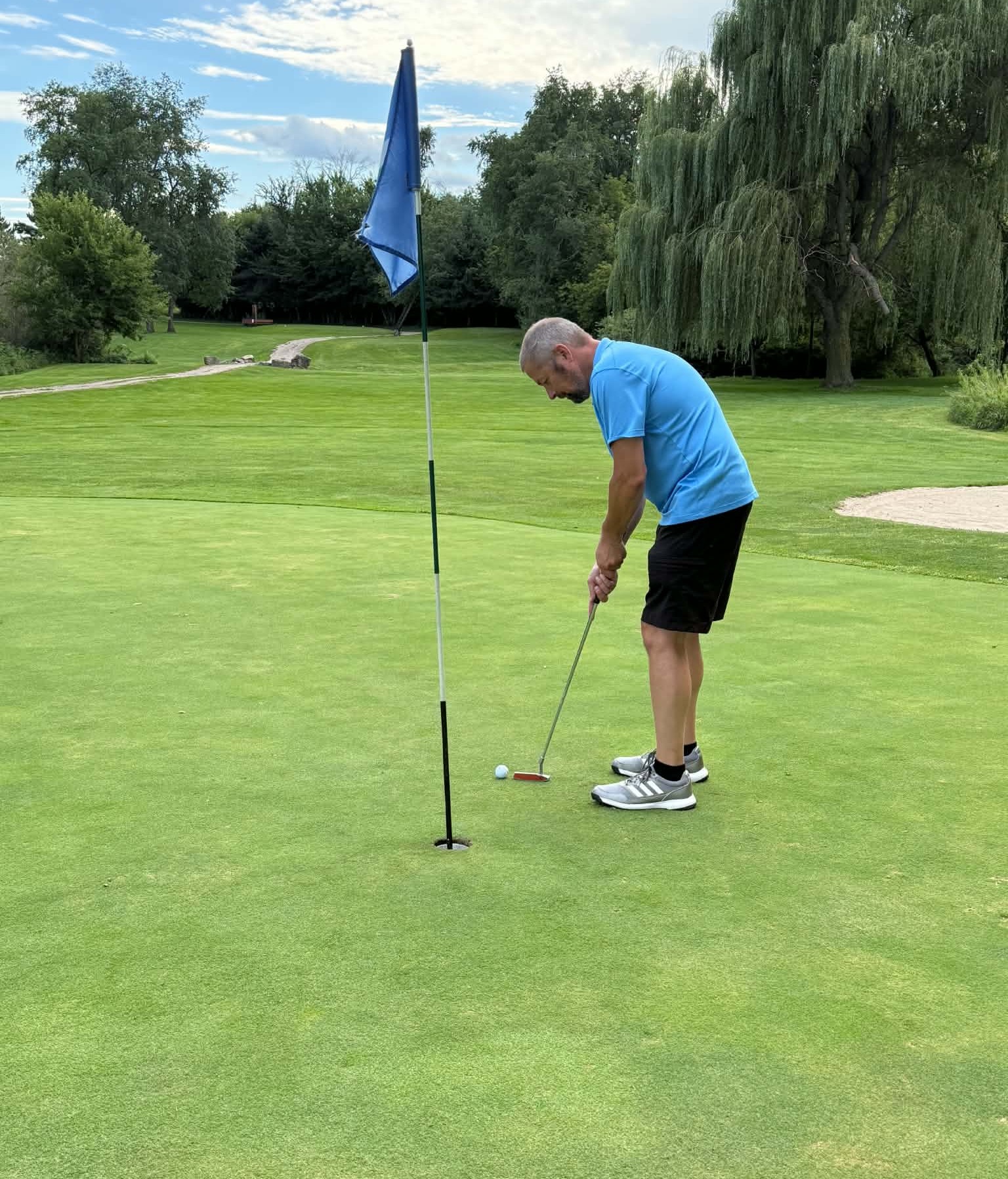 Jason on the green about to make par